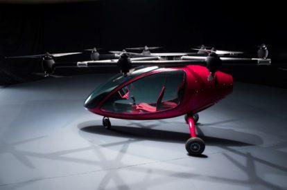 Red electric takeoff and landing vehicle reminiscent of the flying cars in the Jetsons.