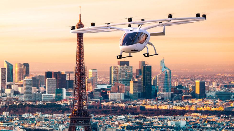 An eVTOL, also known as a flying car, flies past the Eiffel Tower in Paris.