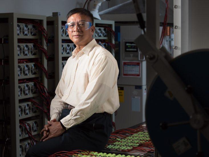 Photo of researcher with safety glasses on.