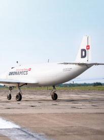 Image of white plane on runway.