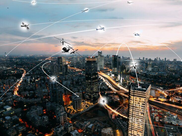 Illustration of a futuristic city skyline at dusk with many different types of aircraft.
