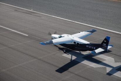 white and black Xwing aircraft on runway