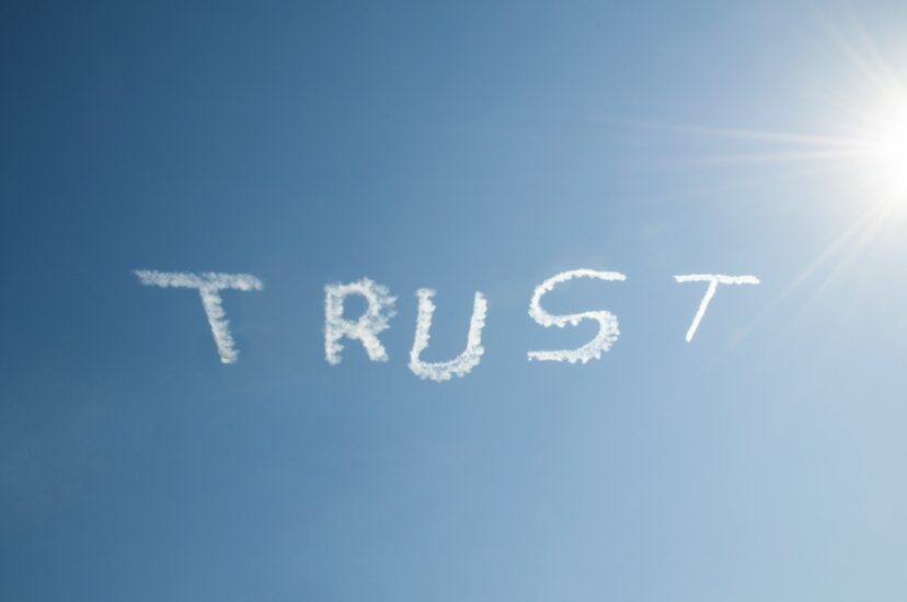 The word "Trust" in skywriting