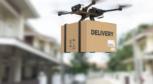 Drone carrying a box for delivery.