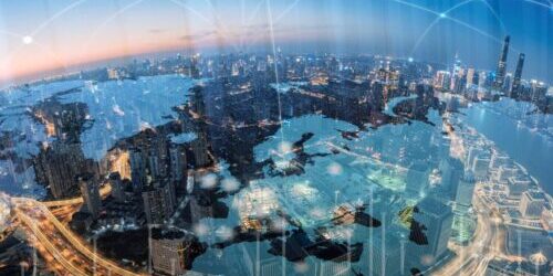 A multitude of air taxis flying over a cityscape.